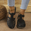Women's black closed-toe wedge sandals with ankle strap