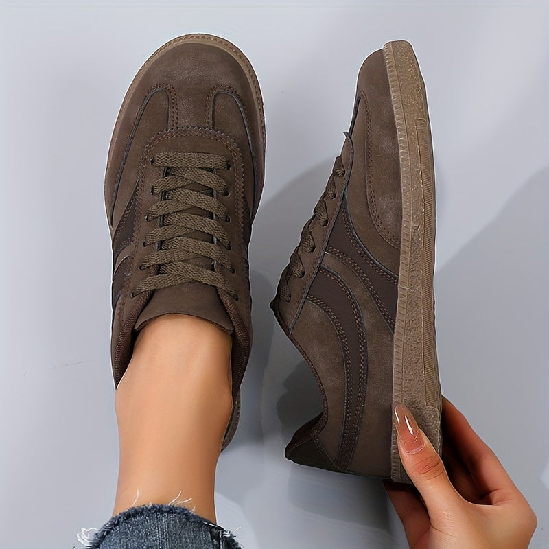 Women's brown retro low top sneakers with vintage style upper